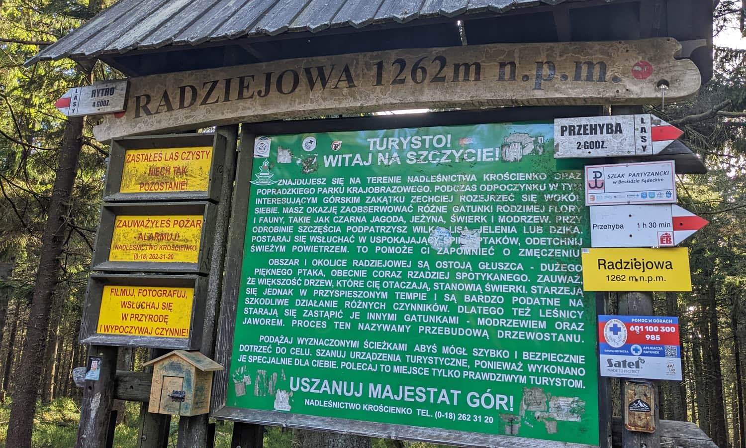 At the summit of Radziejowa - plaque and box with a souvenir stamp (bottom left)