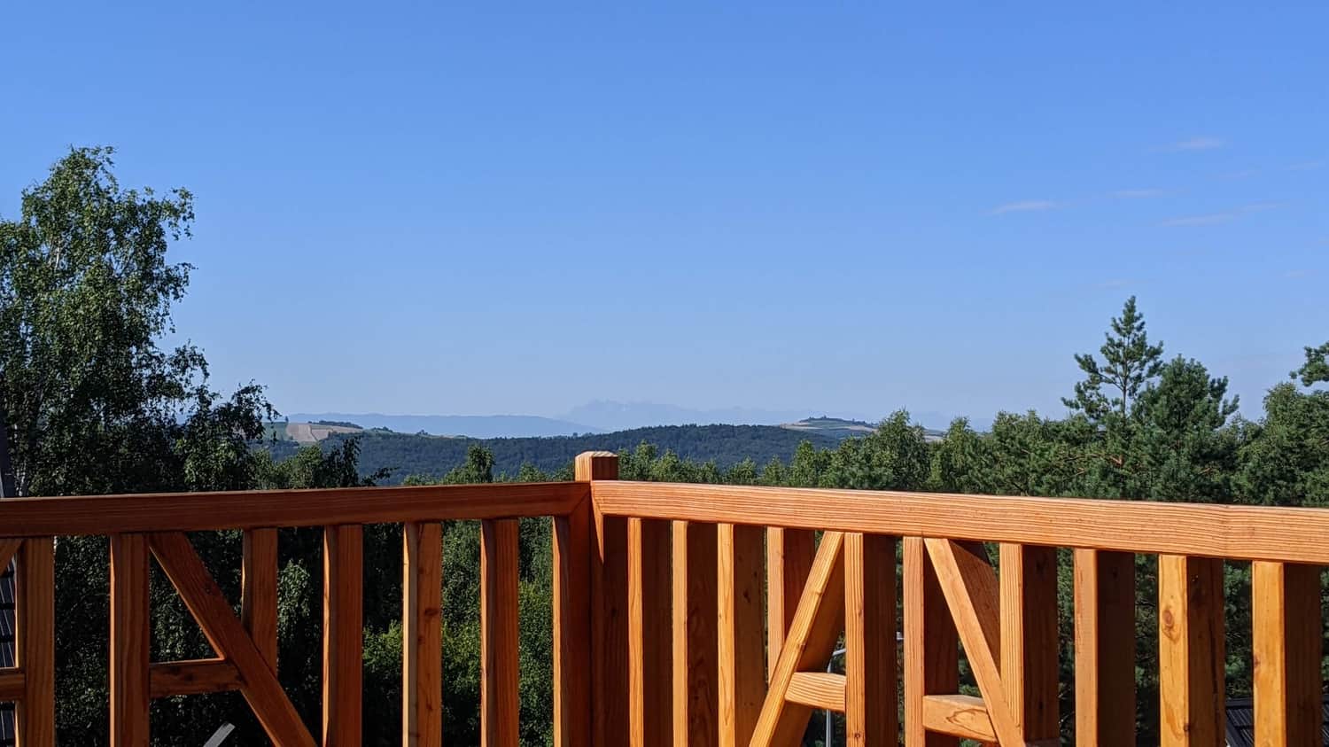 View of the Tatra Mountains from the lodge terrace during breakfast