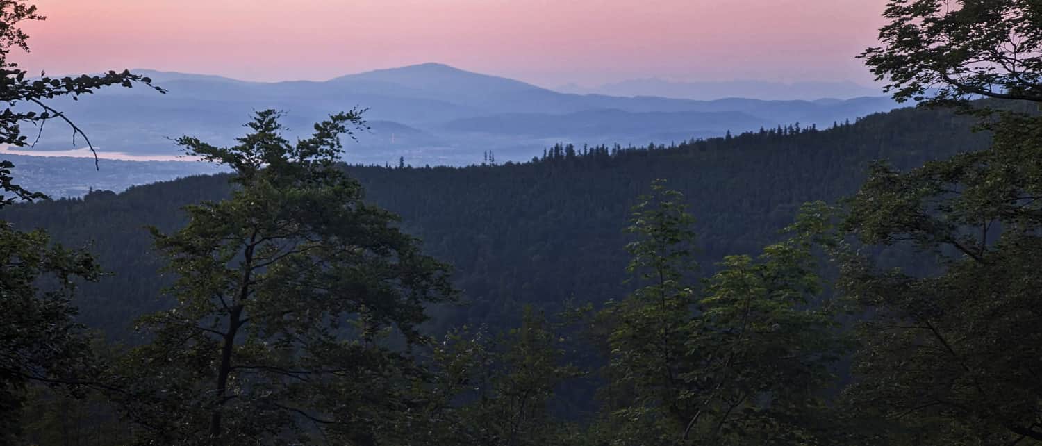 Żywiec Lake, Babia Góra, and the Tatra Mountains faint on the horizon just before sunrise on Szyndzielnia