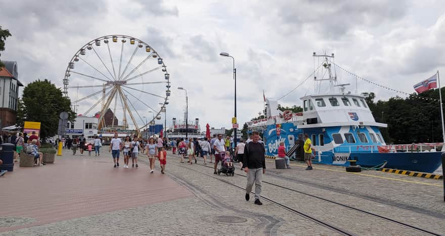 Promenade by the seaport and lighthouse in Kołobrzeg