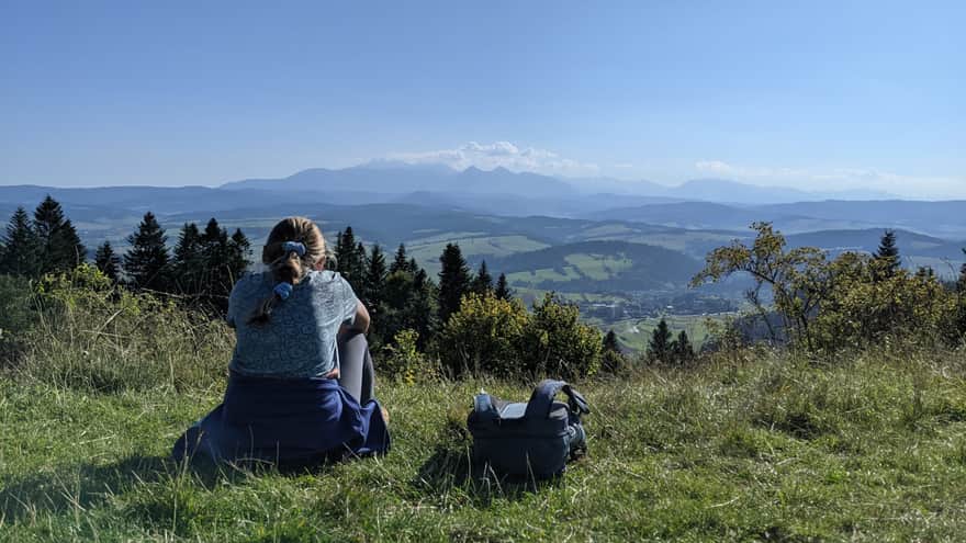 Resting on a meadow with a view of the Tatra Mountains
