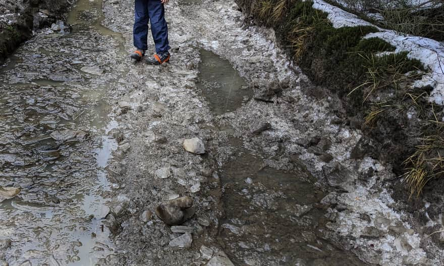 Mountains in winter: icy trail during thaw