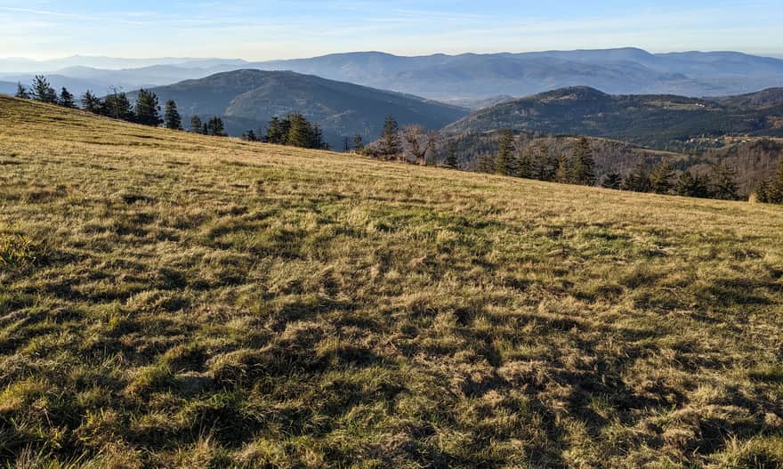 View from Pawlusia Meadow to the Silesian and Silesian-Moravian Beskids (in the background). Yellow trail Rysianka - Romanka.